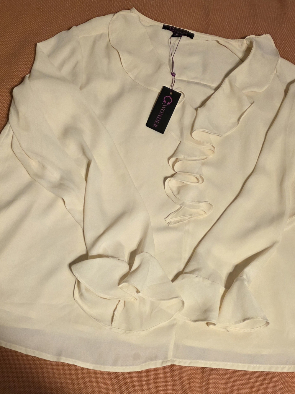 C. Wonder Cream Ruffle Front Blouse
